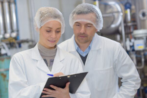two staff members asking what does HACCP stand for