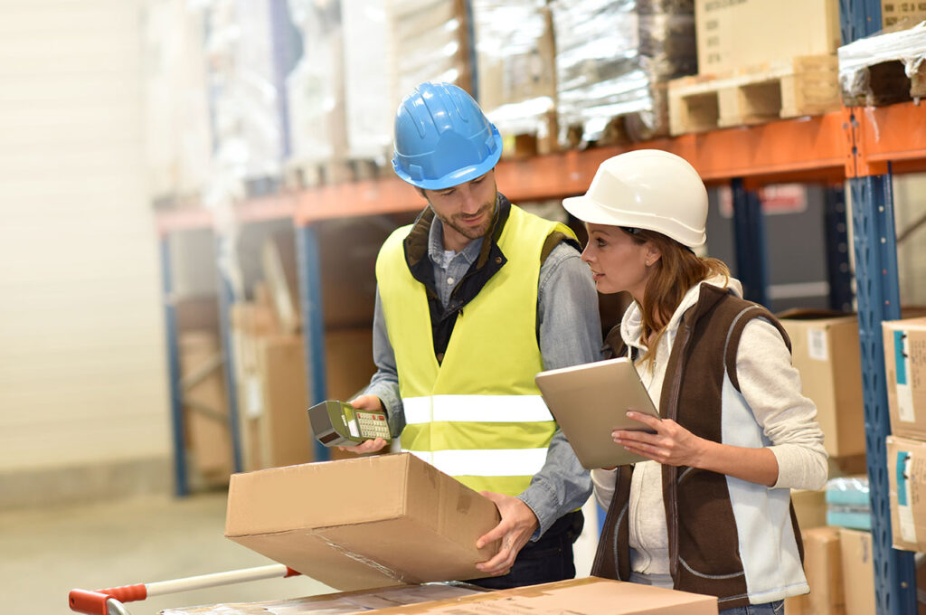 two workers in a distribution hub accredited with a BRCGS certification