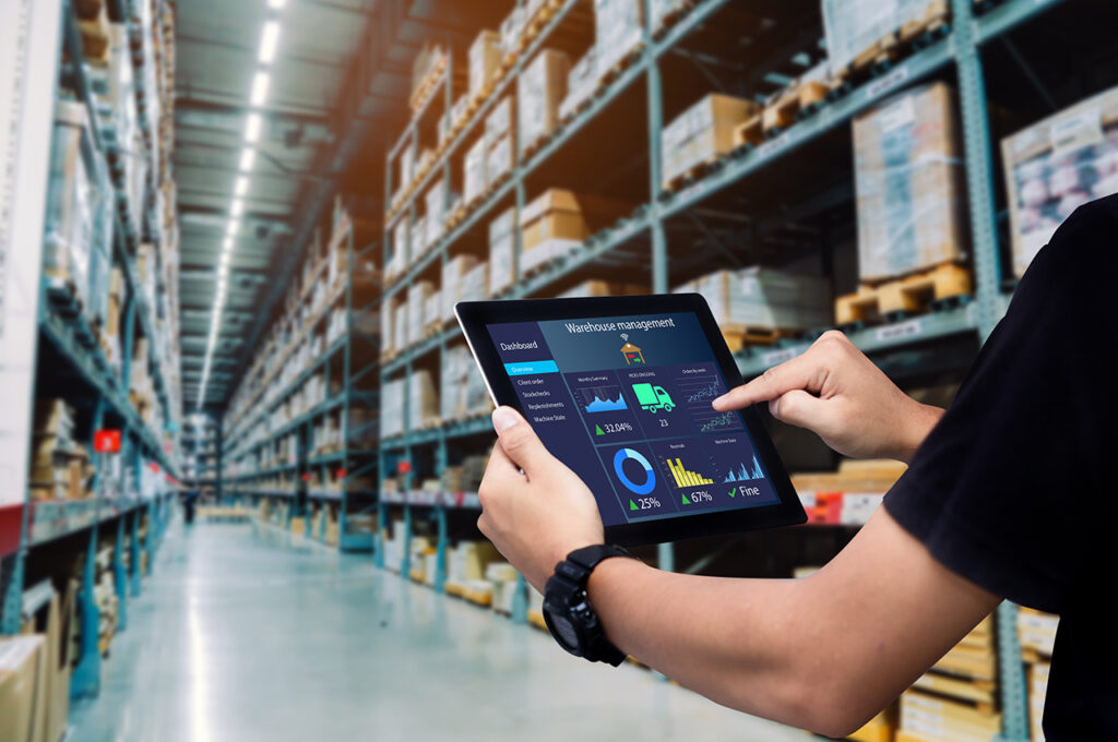 a warehouse worker using supply chain technology